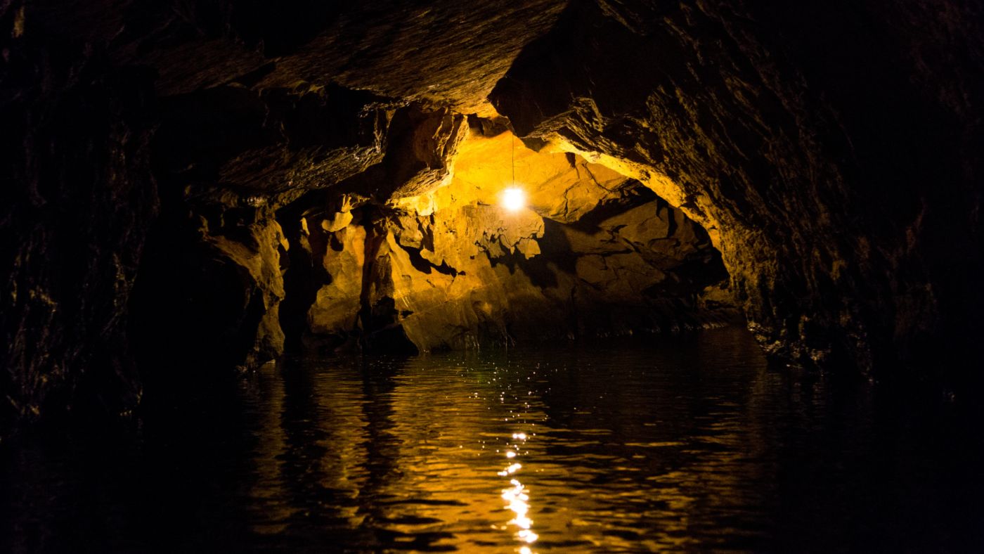 A female tourist exploring the scenic beauty of Tam Coc, Ninh Binh