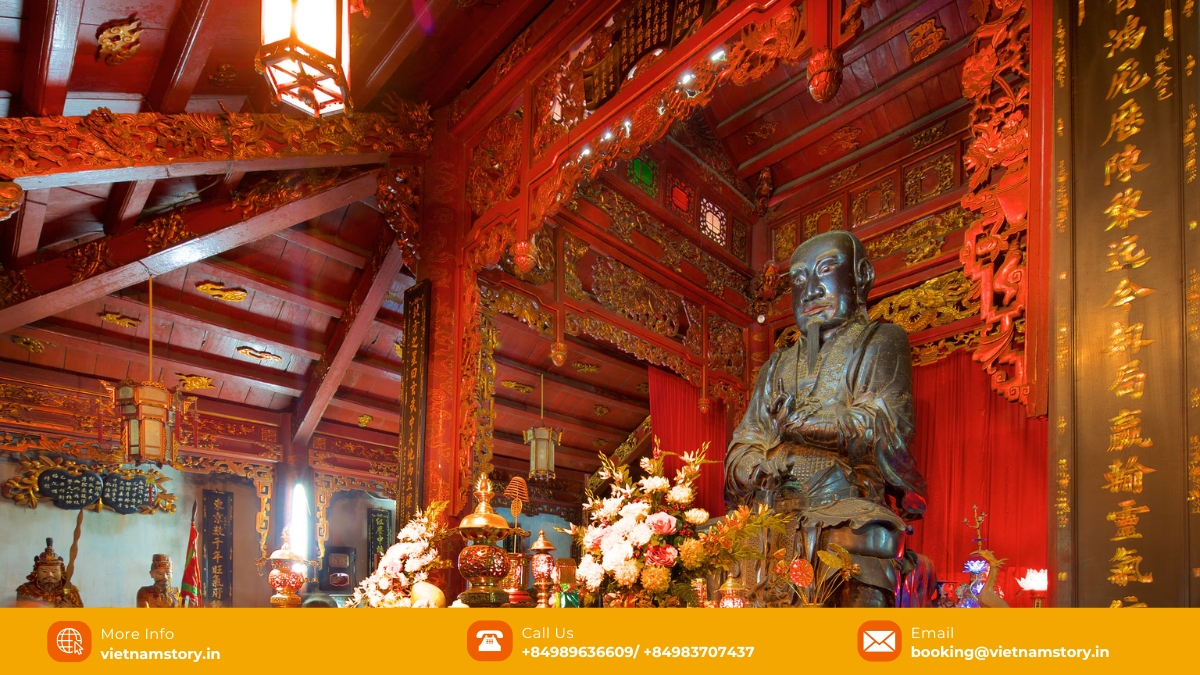 Close up of the bronze statue of Tran Vu in Quan Thanh Temple, showing the intricate detail