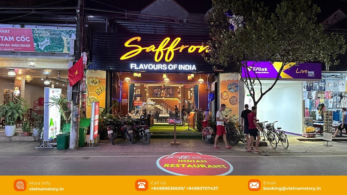 Tourists enjoy eating food at Saffron Indian restaurant
