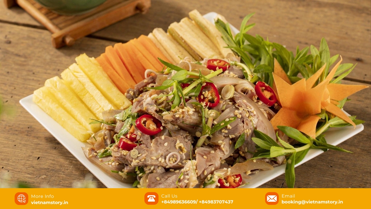 Ninh Binh's signature dish: Rare goat meat with lemon (De Tai Chanh) garnished with peanuts and herbs.