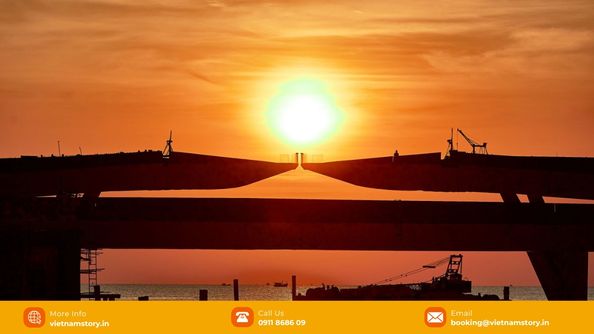 A couple taking a photo on the Kiss Bridge, showcasing the scale and design of the structure.