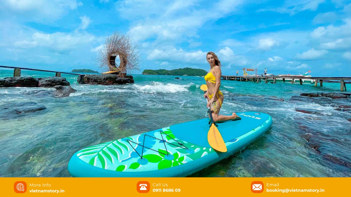 Best May Rut Island Day Trips from Phu Quoc for Indians (Update 2025 List) 2 A visitor relaxing on a beachside hammock strung between coconut trees on May Rut Trong, a popular activity